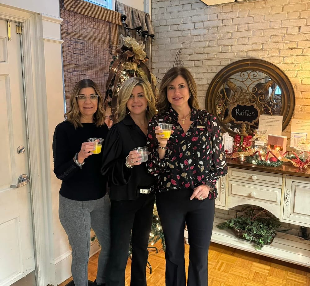 La Bella Donna staff toasting at the Holiday Open House