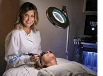 Esthetician Kim Amos performing a HydraFacial